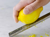 Photograph of grating a lemon.